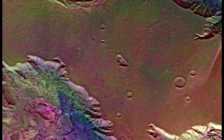 <h1>PIA00155:  West Candor Chasm (Enhanced Color)</h1><div class="PIA00155" lang="en" style="width:800px;text-align:left;margin:auto;background-color:#000;padding:10px;max-height:150px;overflow:auto;">This picture (centered at latitude 4 degrees S., longitude 76 degrees W.) shows areas of central Valles Marineris, including Candor Chasm (lower left), Ophir Chasm (lower right), and Hebes Chasm (upper right). Complex layered deposits in the canyons may have been deposited in lakes, and if so, are of great interest for future searches for fossil life on Mars. The pinkish deposits in Candor Chasm may be due to hydrothermal alterations and the production of crystalline ferric oxides (Geissler et al., 1993, Icarus 106,380). Viking Orbiter Picture Numbers 279B02 (violet), 279B10 (green), and 279B12 (red) at 240 m/pixel resolution. Picture width is 231 km. North is 47 degrees clockwise from top.<br /><br /><a href="http://photojournal.jpl.nasa.gov/catalog/PIA00155" onclick="window.open(this.href); return false;" title="Voir l'image 	 PIA00155:  West Candor Chasm (Enhanced Color)	  sur le site de la NASA">Voir l'image 	 PIA00155:  West Candor Chasm (Enhanced Color)	  sur le site de la NASA.</a></div>