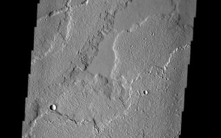 <h1>PIA01307:  Ascraeus Mons</h1><div class="PIA01307" lang="en" style="width:574px;text-align:left;margin:auto;background-color:#000;padding:10px;max-height:150px;overflow:auto;"><p><a href="/figures/PIA01307_fig1.jpg"></a><br><b>Context image for PIA01307<br />Ascraeus Mons</b></p><p>These lava flows and collapse features are part of Ascraeus Mons.</p><p>Image information: VIS instrument. Latitude 17.6N, Longitude 262.9E. 18 meter/pixel resolution.</p><p>Please see the <a href="http://themis.asu.edu/terms" target="_blank">THEMIS Data Citation Note</a> for details on crediting THEMIS images.</p><p>Note: this THEMIS visual image has not been radiometrically nor geometrically calibrated for this preliminary release. An empirical correction has been performed to remove instrumental effects. A linear shift has been applied in the cross-track and down-track direction to approximate spacecraft and planetary motion. Fully calibrated and geometrically projected images will be released through the Planetary Data System in accordance with Project policies at a later time.</p><p>NASA's Jet Propulsion Laboratory manages the 2001 Mars Odyssey mission for NASA's Office of Space Science, Washington, D.C. The Thermal Emission Imaging System (THEMIS) was developed by Arizona State University, Tempe, in collaboration with Raytheon Santa Barbara Remote Sensing. The THEMIS investigation is led by Dr. Philip Christensen at Arizona State University. Lockheed Martin Astronautics, Denver, is the prime contractor for the Odyssey project, and developed and built the orbiter. Mission operations are conducted jointly from Lockheed Martin and from JPL, a division of the California Institute of Technology in Pasadena.</p><br /><br /><a href="http://photojournal.jpl.nasa.gov/catalog/PIA01307" onclick="window.open(this.href); return false;" title="Voir l'image 	 PIA01307:  Ascraeus Mons	  sur le site de la NASA">Voir l'image 	 PIA01307:  Ascraeus Mons	  sur le site de la NASA.</a></div>