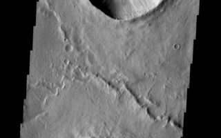 <h1>PIA01314:  Two Craters</h1><div class="PIA01314" lang="en" style="width:556px;text-align:left;margin:auto;background-color:#000;padding:10px;max-height:150px;overflow:auto;"><p><a href="/figures/PIA01314_fig1.jpg"></a><br><b>Context image for PIA01314<br />Two Craters</b></p><p>The two craters in this image are located in Zephyria Planum. The crater floors appear to be modified only by deposits of fine materials.</p><p>Image information: VIS instrument. Latitude 0.3N, Longitude 155.5E. 18 meter/pixel resolution.</p><p>Please see the <a href="http://themis.asu.edu/terms" target="_blank">THEMIS Data Citation Note</a> for details on crediting THEMIS images.</p><p>Note: this THEMIS visual image has not been radiometrically nor geometrically calibrated for this preliminary release. An empirical correction has been performed to remove instrumental effects. A linear shift has been applied in the cross-track and down-track direction to approximate spacecraft and planetary motion. Fully calibrated and geometrically projected images will be released through the Planetary Data System in accordance with Project policies at a later time.</p><p>NASA's Jet Propulsion Laboratory manages the 2001 Mars Odyssey mission for NASA's Office of Space Science, Washington, D.C. The Thermal Emission Imaging System (THEMIS) was developed by Arizona State University, Tempe, in collaboration with Raytheon Santa Barbara Remote Sensing. The THEMIS investigation is led by Dr. Philip Christensen at Arizona State University. Lockheed Martin Astronautics, Denver, is the prime contractor for the Odyssey project, and developed and built the orbiter. Mission operations are conducted jointly from Lockheed Martin and from JPL, a division of the California Institute of Technology in Pasadena.</p><br /><br /><a href="http://photojournal.jpl.nasa.gov/catalog/PIA01314" onclick="window.open(this.href); return false;" title="Voir l'image 	 PIA01314:  Two Craters	  sur le site de la NASA">Voir l'image 	 PIA01314:  Two Craters	  sur le site de la NASA.</a></div>