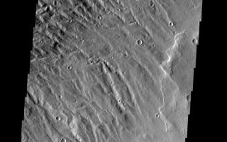 <h1>PIA01774:  Acheron Fossae</h1><div class="PIA01774" lang="en" style="width:593px;text-align:left;margin:auto;background-color:#000;padding:10px;max-height:150px;overflow:auto;"><p><a href="/figures/PIA01774_fig1.jpg"></a><br><b>Context image for PIA01774<br />Acheron Fossae</b></p><p>This heavily dissected surface is located within the Acheron Fossae region.<p>Image information: VIS instrument. Latitude 34.5N, Longitude 218.9E. 19 meter/pixel resolution.</p><p>Please see the <a href="http://themis.asu.edu/terms" target="_blank">THEMIS Data Citation Note</a> for details on crediting THEMIS images.</p><p>Note: this THEMIS visual image has not been radiometrically nor geometrically calibrated for this preliminary release. An empirical correction has been performed to remove instrumental effects. A linear shift has been applied in the cross-track and down-track direction to approximate spacecraft and planetary motion. Fully calibrated and geometrically projected images will be released through the Planetary Data System in accordance with Project policies at a later time.</p><p>NASA's Jet Propulsion Laboratory manages the 2001 Mars Odyssey mission for NASA's Office of Space Science, Washington, D.C. The Thermal Emission Imaging System (THEMIS) was developed by Arizona State University, Tempe, in collaboration with Raytheon Santa Barbara Remote Sensing. The THEMIS investigation is led by Dr. Philip Christensen at Arizona State University. Lockheed Martin Astronautics, Denver, is the prime contractor for the Odyssey project, and developed and built the orbiter. Mission operations are conducted jointly from Lockheed Martin and from JPL, a division of the California Institute of Technology in Pasadena.</p><br /><br /><a href="http://photojournal.jpl.nasa.gov/catalog/PIA01774" onclick="window.open(this.href); return false;" title="Voir l'image 	 PIA01774:  Acheron Fossae	  sur le site de la NASA">Voir l'image 	 PIA01774:  Acheron Fossae	  sur le site de la NASA.</a></div>