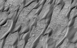 <h1>PIA03176:  Dunes in Herschel Crater (Herschel Crater: 15.7 S, 228.8 W)</h1><div class="PIA03176" lang="en" style="width:600px;text-align:left;margin:auto;background-color:#000;padding:10px;max-height:150px;overflow:auto;"><p>This MGS MOC image shows erosional streaks on dunes which means that the dunes are indurated (cemented).<p>Malin Space Science Systems and the California Institute of Technology built the MOC using spare hardware from the Mars Observer mission. MSSS operates the camera from its facilities in San Diego, CA. The Jet Propulsion Laboratory's Mars Surveyor Operations Project operates the Mars Global Surveyor spacecraft with its industrial partner, Lockheed Martin Astronautics, from facilities in Pasadena, CA and Denver, CO.<br /><br /><a href="http://photojournal.jpl.nasa.gov/catalog/PIA03176" onclick="window.open(this.href); return false;" title="Voir l'image 	 PIA03176:  Dunes in Herschel Crater (Herschel Crater: 15.7 S, 228.8 W)	  sur le site de la NASA">Voir l'image 	 PIA03176:  Dunes in Herschel Crater (Herschel Crater: 15.7 S, 228.8 W)	  sur le site de la NASA.</a></div>