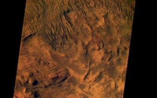 <h1>PIA04028:  Candor Chasma on Mars, in Color</h1><div class="PIA04028" lang="en" style="width:641px;text-align:left;margin:auto;background-color:#000;padding:10px;max-height:150px;overflow:auto;"><p><a href="/figures/PIA04028_context.jpg"></a><br><p>This image from the camera system on NASA. Mars Odyssey was acquired of Candor Chasma within Valles Marineris, centered near 5 degrees south latitude, 283 degrees east longitude. This visible color image shows the effects of erosion on a sequence of dramatically layered rocks. These layers were initially deposited within Candor Chasma and have subsequently been eroded by a variety of processes, including wind and down-slope motion due to gravity. Relatively dark materials appear to mantle some areas of the layered deposits; these dark materials are likely sand. Few impact craters of any size can be seen in this image, indicating that the erosion and transport of material is occurring at a relatively rapid rate, so that any craters that form are rapidly buried or eroded. This image was acquired using the thermal infrared imaging system.s visible bands 1 (centered at 420 nanometers), 2 (centered at 550 nanometers), and 3 (centered at 650 nanometers), and covers an area approximately 19 kilometers (12 miles) in width by 50 kilometers (50 miles) in length.<p>This and several other new color images can be obtained from the NASA Planetary Photojournal website.<p>Note: this THEMIS visual image has not been radiometrically nor geometrically calibrated for this preliminary release. An empirical correction has been performed to remove instrumental effects. A linear shift has been applied in the cross-track and down-track direction to approximate spacecraft and planetary motion. Fully calibrated and geometrically projected images will be released through the Planetary Data System in accordance with Project policies at a later time.<p>NASA's Jet Propulsion Laboratory manages the 2001 Mars Odyssey mission for NASA's Office of Space Science, Washington, D.C. The Thermal Emission Imaging System (THEMIS) was developed by Arizona State University, Tempe, in collaboration with Raytheon Santa Barbara Remote Sensing. The THEMIS investigation is led by Dr. Philip Christensen at Arizona State University. Lockheed Martin Astronautics, Denver, is the prime contractor for the Odyssey project, and developed and built the orbiter. Mission operations are conducted jointly from Lockheed Martin and from JPL, a division of the California Institute of Technology in Pasadena.<p><br /><br /><a href="http://photojournal.jpl.nasa.gov/catalog/PIA04028" onclick="window.open(this.href); return false;" title="Voir l'image 	 PIA04028:  Candor Chasma on Mars, in Color	  sur le site de la NASA">Voir l'image 	 PIA04028:  Candor Chasma on Mars, in Color	  sur le site de la NASA.</a></div>