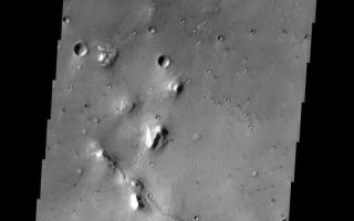 <h1>PIA04448:  Cydonia Craters</h1><div class="PIA04448" lang="en" style="width:545px;text-align:left;margin:auto;background-color:#000;padding:10px;max-height:150px;overflow:auto;"><p><a href="/figures/PIA04448_context.jpg"></a><br><p>Eroded mesas and secondary craters dot the landscape in this area of the Cydonia Mensae region. The single oval-shaped crater displays a "butterfly" ejecta pattern, indicating that the crater formed from a low-angle impact.<p>Note: this THEMIS visual image has not been radiometrically nor geometrically calibrated for this preliminary release. An empirical correction has been performed to remove instrumental effects. A linear shift has been applied in the cross-track and down-track direction to approximate spacecraft and planetary motion. Fully calibrated and geometrically projected images will be released through the Planetary Data System in accordance with Project policies at a later time.<p>NASA's Jet Propulsion Laboratory manages the 2001 Mars Odyssey mission for NASA's Office of Space Science, Washington, D.C. The Thermal Emission Imaging System (THEMIS) was developed by Arizona State University, Tempe, in collaboration with Raytheon Santa Barbara Remote Sensing. The THEMIS investigation is led by Dr. Philip Christensen at Arizona State University. Lockheed Martin Astronautics, Denver, is the prime contractor for the Odyssey project, and developed and built the orbiter. Mission operations are conducted jointly from Lockheed Martin and from JPL, a division of the California Institute of Technology in Pasadena.<p>Image information: VIS instrument. Latitude 32.9, Longitude 343.8 East (16.2 West). 19 meter/pixel resolution.<p><br /><br /><a href="http://photojournal.jpl.nasa.gov/catalog/PIA04448" onclick="window.open(this.href); return false;" title="Voir l'image 	 PIA04448:  Cydonia Craters	  sur le site de la NASA">Voir l'image 	 PIA04448:  Cydonia Craters	  sur le site de la NASA.</a></div>