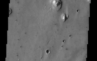 <h1>PIA04450:  Acidalia Planitia</h1><div class="PIA04450" lang="en" style="width:479px;text-align:left;margin:auto;background-color:#000;padding:10px;max-height:150px;overflow:auto;"><p><a href="/figures/PIA04450_context.jpg"></a><br><p>This is an image of an area within Acidalia Planitia that contains patterned ground near the top of the image. This type of surface is likely related to subsurface ice. There are other strange features in this image, including a range of crater morphologies and steps or terraces surrounding the isolated knobs.<p>Note: this THEMIS visual image has not been radiometrically nor geometrically calibrated for this preliminary release. An empirical correction has been performed to remove instrumental effects. A linear shift has been applied in the cross-track and down-track direction to approximate spacecraft and planetary motion. Fully calibrated and geometrically projected images will be released through the Planetary Data System in accordance with Project policies at a later time.<p>NASA's Jet Propulsion Laboratory manages the 2001 Mars Odyssey mission for NASA's Office of Space Science, Washington, D.C. The Thermal Emission Imaging System (THEMIS) was developed by Arizona State University, Tempe, in collaboration with Raytheon Santa Barbara Remote Sensing. The THEMIS investigation is led by Dr. Philip Christensen at Arizona State University. Lockheed Martin Astronautics, Denver, is the prime contractor for the Odyssey project, and developed and built the orbiter. Mission operations are conducted jointly from Lockheed Martin and from JPL, a division of the California Institute of Technology in Pasadena.<p>Image information: VIS instrument. Latitude 33.2, Longitude 322.1 East (37.9 West). 19 meter/pixel resolution.<p><br /><br /><a href="http://photojournal.jpl.nasa.gov/catalog/PIA04450" onclick="window.open(this.href); return false;" title="Voir l'image 	 PIA04450:  Acidalia Planitia	  sur le site de la NASA">Voir l'image 	 PIA04450:  Acidalia Planitia	  sur le site de la NASA.</a></div>