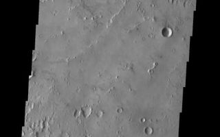 <h1>PIA04538:  Isidis Planitia</h1><div class="PIA04538" lang="en" style="width:531px;text-align:left;margin:auto;background-color:#000;padding:10px;max-height:150px;overflow:auto;"><p><a href="/figures/PIA04538_context.jpg"></a><br><p>Released 23 May 2003<p>Small mounds with depressions at their summits follow curvilinear trends in this portion of Isidis Planitia. While their origin is still unknown, some scientists believe that these were formed by the interaction of lava and ice. The pitted terrain in the lower portion of this image may be secondary craters.<p>Image information: VIS instrument. Latitude 11.8, Longitude 94.7 East (265.3) meter/pixel resolution.<p>Note: this THEMIS visual image has not been radiometrically nor geometrically calibrated for this preliminary release. An empirical correction has been performed to remove instrumental effects. A linear shift has been applied in the cross-track and down-track direction to approximate spacecraft and planetary motion. Fully calibrated and geometrically projected images will be released through the Planetary Data System in accordance with Project policies at a later time.<p>NASA's Jet Propulsion Laboratory manages the 2001 Mars Odyssey mission for NASA's Office of Space Science, Washington, D.C. The Thermal Emission Imaging System (THEMIS) was developed by Arizona State University, Tempe, in collaboration with Raytheon Santa Barbara Remote Sensing. The THEMIS investigation is led by Dr. Philip Christensen at Arizona State University. Lockheed Martin Astronautics, Denver, is the prime contractor for the Odyssey project, and developed and built the orbiter. Mission operations are conducted jointly from Lockheed Martin and from JPL, a division of the California Institute of Technology in Pasadena.<p><br /><br /><a href="http://photojournal.jpl.nasa.gov/catalog/PIA04538" onclick="window.open(this.href); return false;" title="Voir l'image 	 PIA04538:  Isidis Planitia	  sur le site de la NASA">Voir l'image 	 PIA04538:  Isidis Planitia	  sur le site de la NASA.</a></div>