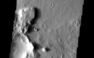 <h1>PIA04555:  Eroded Crater Ejecta</h1><div class="PIA04555" lang="en" style="width:533px;text-align:left;margin:auto;background-color:#000;padding:10px;max-height:150px;overflow:auto;"><p><a href="/figures/PIA04555_context.jpg"></a><br><p>Released 3 June 2003</p><p>Two craters in Arabia Terra, in the old cratered highlands, are surrounded by many small mesas. The two craters are partially shown in the central-left and extreme upper-right of the image. These mesas are remnants of ejecta blankets of debris that were cast out when the impact craters originally formed. These former ejecta blankets formed a material resistant to weathering, and so they remain on the surface as mesas, while the surrounding terrain has been stripped away.</p><p>Image information: VIS instrument. Latitude 17.1, Longitude 8 East (352 West). 19 meter/pixel resolution.</p><p>Note: this THEMIS visual image has not been radiometrically nor geometrically calibrated for this preliminary release. An empirical correction has been performed to remove instrumental effects. A linear shift has been applied in the cross-track and down-track direction to approximate spacecraft and planetary motion. Fully calibrated and geometrically projected images will be released through the Planetary Data System in accordance with Project policies at a later time.<p>NASA's Jet Propulsion Laboratory manages the 2001 Mars Odyssey mission for NASA's Office of Space Science, Washington, D.C. The Thermal Emission Imaging System (THEMIS) was developed by Arizona State University, Tempe, in collaboration with Raytheon Santa Barbara Remote Sensing. The THEMIS investigation is led by Dr. Philip Christensen at Arizona State University. Lockheed Martin Astronautics, Denver, is the prime contractor for the Odyssey project, and developed and built the orbiter. Mission operations are conducted jointly from Lockheed Martin and from JPL, a division of the California Institute of Technology in Pasadena.</p><br /><br /><a href="http://photojournal.jpl.nasa.gov/catalog/PIA04555" onclick="window.open(this.href); return false;" title="Voir l'image 	 PIA04555:  Eroded Crater Ejecta	  sur le site de la NASA">Voir l'image 	 PIA04555:  Eroded Crater Ejecta	  sur le site de la NASA.</a></div>