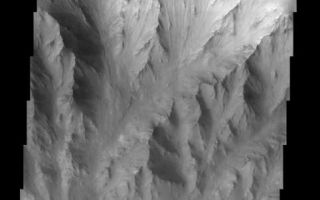 <h1>PIA04814:  Layers, Landslides, and Sand Dunes</h1><div class="PIA04814" lang="en" style="width:482px;text-align:left;margin:auto;background-color:#000;padding:10px;max-height:150px;overflow:auto;"><p /><a href="/figures/PIA04814_context.jpg"></a><br /><p />Released 27 October 2003<p />This image shows the northern rim of one of the Valles Marineris canyons. Careful inspection shows many interesting features here. Note that the spurs and gullies in the canyon wall disappear some distance below the top of the canyon wall, indicating the presence of some smooth material here that weathers differently from the underlying rocks. On the floor of the canyon, there are remains from a landslide that came hurtling down the canyon wall between two spurs. Riding over the topography of the canyon floor are many large sand dunes, migrating generally from the lower right to upper left.<p />Image information: VIS instrument. Latitude -14.1, Longitude 306.7 East (53.3 West). 19 meter/pixel resolution.<p />Note: this THEMIS visual image has not been radiometrically nor geometrically calibrated for this preliminary release. An empirical correction has been performed to remove instrumental effects. A linear shift has been applied in the cross-track and down-track direction to approximate spacecraft and planetary motion. Fully calibrated and geometrically projected images will be released through the Planetary Data System in accordance with Project policies at a later time. <p />NASA's Jet Propulsion Laboratory manages the 2001 Mars Odyssey mission for NASA's Office of Space Science, Washington, D.C. The Thermal Emission Imaging System (THEMIS) was developed by Arizona State University, Tempe, in collaboration with Raytheon Santa Barbara Remote Sensing. The THEMIS investigation is led by Dr. Philip Christensen at Arizona State University. Lockheed Martin Astronautics, Denver, is the prime contractor for the Odyssey project, and developed and built the orbiter. Mission operations are conducted jointly from Lockheed Martin and from JPL, a division of the California Institute of Technology in Pasadena.<br /><br /><a href="http://photojournal.jpl.nasa.gov/catalog/PIA04814" onclick="window.open(this.href); return false;" title="Voir l'image 	 PIA04814:  Layers, Landslides, and Sand Dunes	  sur le site de la NASA">Voir l'image 	 PIA04814:  Layers, Landslides, and Sand Dunes	  sur le site de la NASA.</a></div>