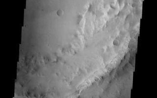 <h1>PIA10062:  Crater Rim Slump</h1><div class="PIA10062" lang="en" style="width:575px;text-align:left;margin:auto;background-color:#000;padding:10px;max-height:150px;overflow:auto;"><p><a href="/figures/PIA10062_fig1.jpg"></a><br><b>Context image for PIA10062<br />Crater Rim Slump</b></p><p>This unnamed crater is located in Syrtis Major Planum. The inner portion of the rim at the top of the image has failed in a mode termed 'slump.' A large section has slid to the floor creating a landslide-type deposit and leaving relatively smooth cliff face.<p>Image information: VIS instrument. Latitude 3.8N, Longitude 71.1E. 18 meter/pixel resolution.</p><p>Please see the <a href="http://themis.asu.edu/terms" target="_blank">THEMIS Data Citation Note</a> for details on crediting THEMIS images.</p><p>Note: this THEMIS visual image has not been radiometrically nor geometrically calibrated for this preliminary release. An empirical correction has been performed to remove instrumental effects. A linear shift has been applied in the cross-track and down-track direction to approximate spacecraft and planetary motion. Fully calibrated and geometrically projected images will be released through the Planetary Data System in accordance with Project policies at a later time.</p><p>NASA's Jet Propulsion Laboratory manages the 2001 Mars Odyssey mission for NASA's Office of Space Science, Washington, D.C. The Thermal Emission Imaging System (THEMIS) was developed by Arizona State University, Tempe, in collaboration with Raytheon Santa Barbara Remote Sensing. The THEMIS investigation is led by Dr. Philip Christensen at Arizona State University. Lockheed Martin Astronautics, Denver, is the prime contractor for the Odyssey project, and developed and built the orbiter. Mission operations are conducted jointly from Lockheed Martin and from JPL, a division of the California Institute of Technology in Pasadena.</p><br /><br /><a href="http://photojournal.jpl.nasa.gov/catalog/PIA10062" onclick="window.open(this.href); return false;" title="Voir l'image 	 PIA10062:  Crater Rim Slump	  sur le site de la NASA">Voir l'image 	 PIA10062:  Crater Rim Slump	  sur le site de la NASA.</a></div>